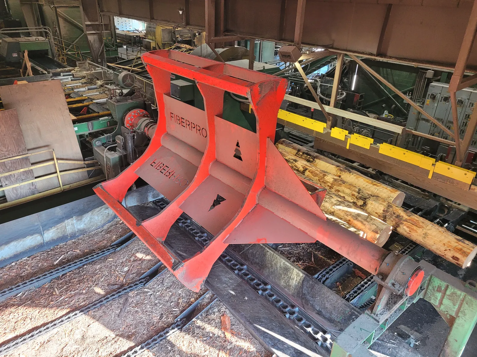 Rotary log kicker bank